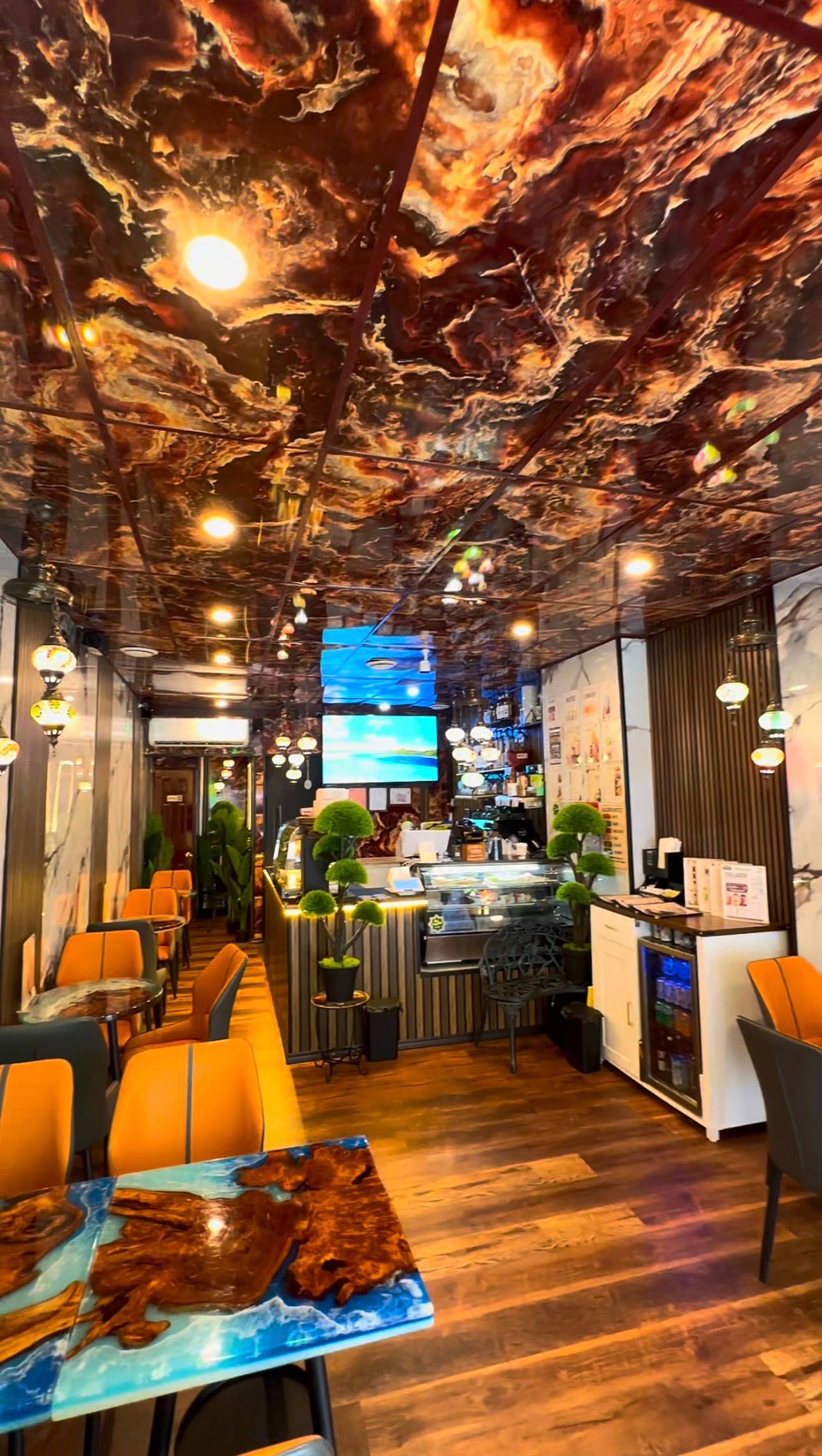 Wide view through the warm Coffeeccino café interior